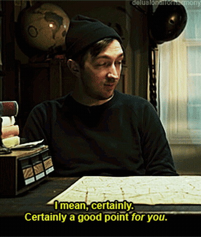A Man Sitting At A Table With A Globe In The Background Says " I Mean Certainly " GIF
