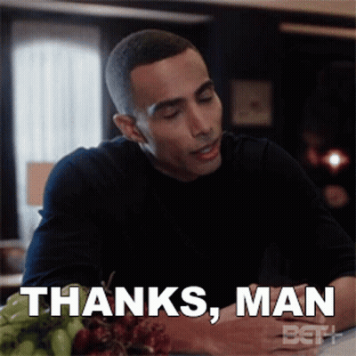 A Man Sitting At A Table With A Plate Of Grapes Says Thanks Man GIF