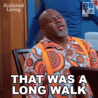 A Man Sitting At A Table With His Eyes Closed And Says That Was A Long Walk GIF