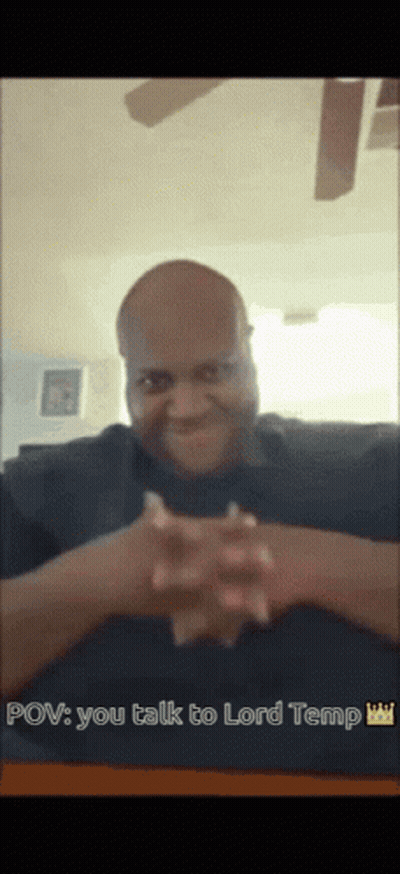 A Man Sitting At A Table With His Hands Folded And The Words Pov You Talk To Lord Temp Above Him GIF