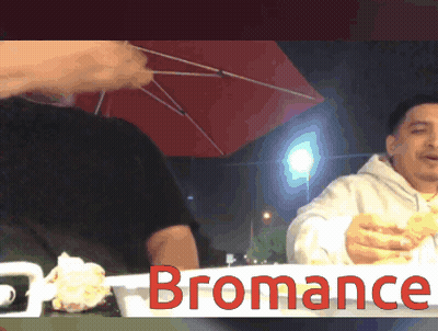 A Man Sitting At A Table With The Word Bromance On The Bottom GIF