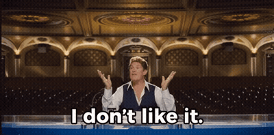 A Man Sitting At A Table With The Words " I Don 'T Like It " Above Him GIF