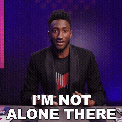 A Man Sitting At A Table With The Words " I 'M Not Alone There " GIF