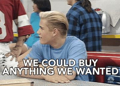 A Man Sitting At A Table With The Words " We Could Buy Anything We Wanted " On The Bottom GIF