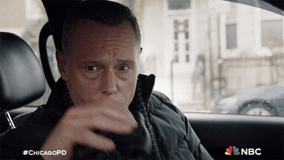 A Man Sitting In A Car With #Chicagopd On The Bottom GIF
