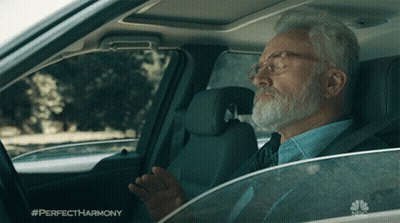 A Man Sitting In A Car With The Hashtag Perfectharmony GIF