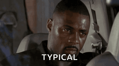A Man Sitting In A Car With The Word Typical Written On The Screen GIF