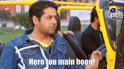 A Man Sitting In A Car With The Words Hero Tou Main Hoon Above Him GIF