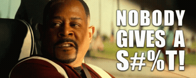 A Man Sitting In A Car With The Words Nobody Gives A S # % T Written Above Him GIF