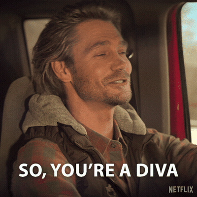 A Man Sitting In A Car With The Words So You 'Re A Diva On The Bottom GIF