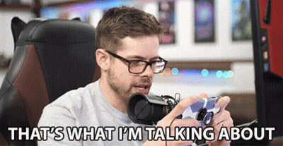 A Man Sitting In A Chair Holding A Video Game Controller With The Words That 'S What I 'M Talking About Below Him GIF