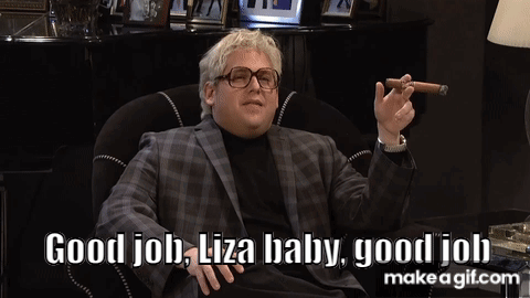 A Man Sitting In A Chair Smoking A Cigar And Says Good Job Liza Baby Good Job GIF
