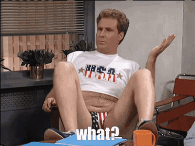 a man sitting in a chair with his legs crossed and a shirt that says usa on it