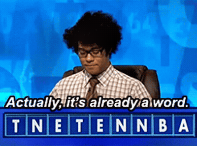 A Man Sitting In A Chair With The Words " Actually It 'S Already A Word " Above Him GIF