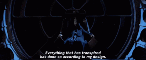 A Man Sitting In A Chair With The Words " Everything That Has Transpired Has Done So According To My Design " Above Him GIF