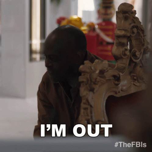 A Man Sitting In A Chair With The Words I 'M Out Above Him GIF