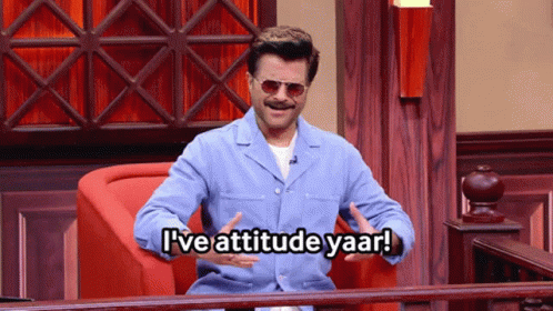 A Man Sitting In A Chair With The Words I 'Ve Attitude Yaar GIF