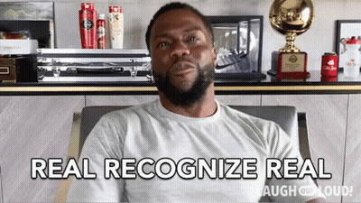 A Man Sitting In A Chair With The Words Real Recognize Real GIF