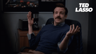 A Man Sitting In A Chair With The Words " The Diamond Dogs Have Struck Again " On The Bottom GIF