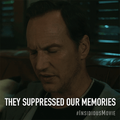 A Man Sitting In A Chair With The Words They Suppressed Our Memories Above Him GIF