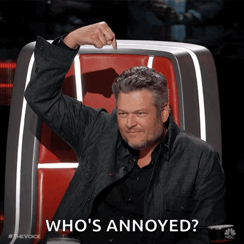 A Man Sitting In A Chair With The Words Who 'S Annoyed Written On The Bottom GIF