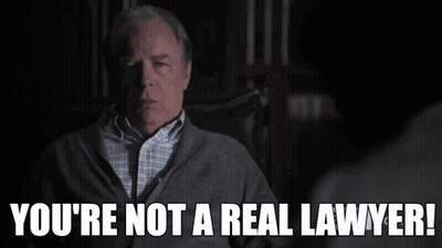 A Man Sitting In A Chair With The Words You 'Re Not A Real Lawyer GIF