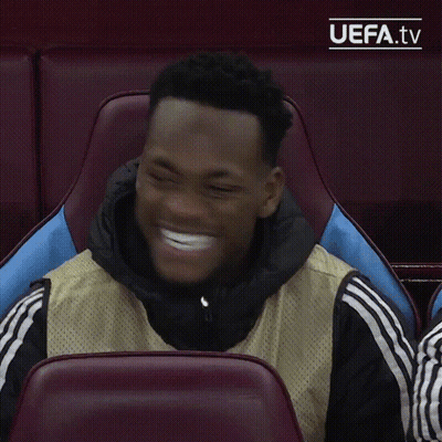 A Man Sitting In A Chair With Uefa.tv Written On The Bottom Right GIF