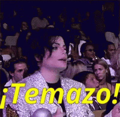 A Man Sitting In A Crowd With The Word Temazo On It GIF