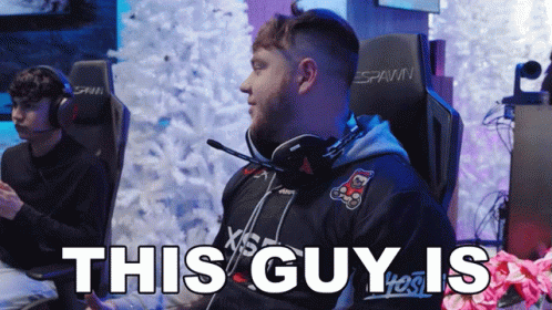 A Man Sitting In A Gaming Chair With The Words " This Guy Is " Below Him GIF