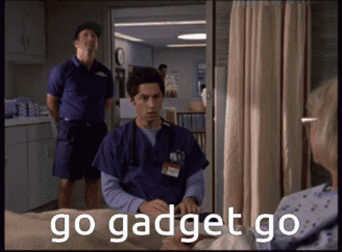 A Man Sitting In A Hospital Bed With The Words Go Gadget Go GIF