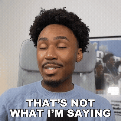 A Man Sitting In An Office Chair With His Eyes Closed And Says " That 'S Not What I 'M Saying " GIF