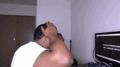 A Man Sitting In Front Of A Computer Screen That Says A World Premiere Event Next Saturday GIF