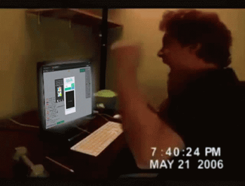 A Man Sitting In Front Of A Computer With The Time Of 7:40 Pm On May 21 2006 GIF