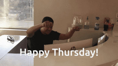 A Man Sitting In Front Of A Computer With The Words Happy Thursday GIF