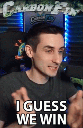 A Man Sitting In Front Of A Computer With The Words I Guess We Win On His Face GIF