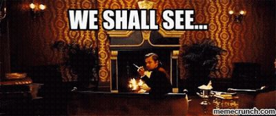 A Man Sitting In Front Of A Fireplace With The Words " We Shall See " Written Above Him GIF
