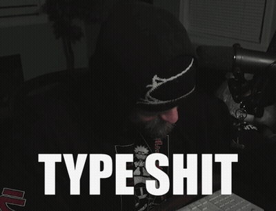 A Man Sitting In Front Of A Keyboard With The Words Type Shit Written On The Screen GIF