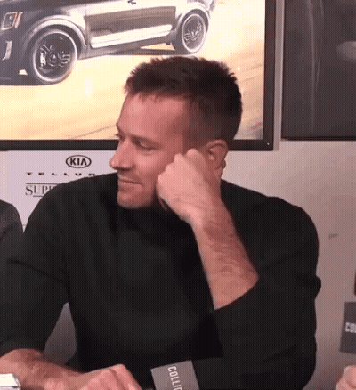 A Man Sitting In Front Of A Kia Car GIF