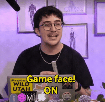A Man Sitting In Front Of A Laptop With A Sticker That Says Game Face On GIF