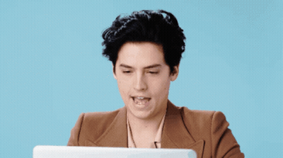 A Man Sitting In Front Of A Laptop With The Words " Absolutely " Below Him GIF