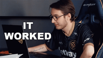 A Man Sitting In Front Of A Laptop With The Words " It Worked " Behind Him GIF