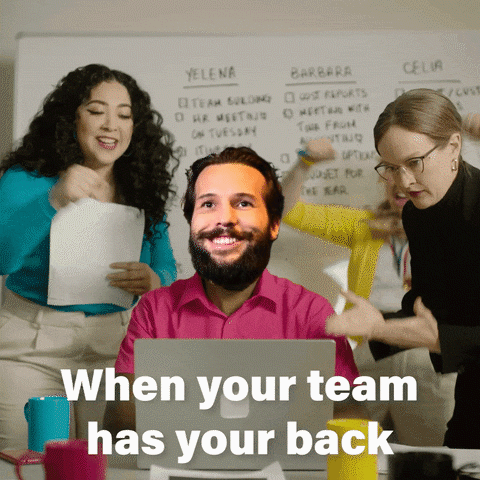 A Man Sitting In Front Of A Laptop With The Words " When Your Team Has Your Back " Written Below Him GIF