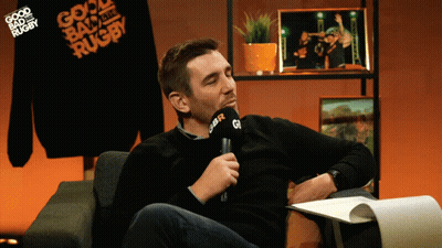 A Man Sitting In Front Of A Microphone That Says Gbr On It GIF
