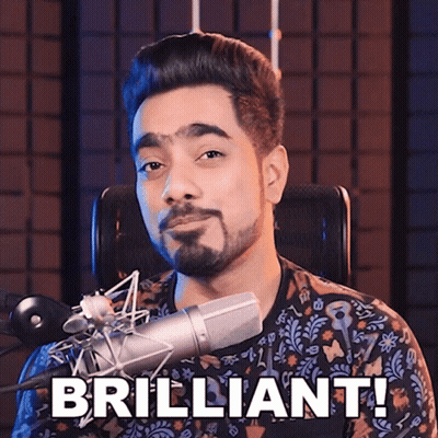 A Man Sitting In Front Of A Microphone With The Words " Brilliant " Written On His Face GIF