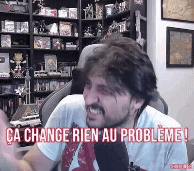 A Man Sitting In Front Of A Microphone With The Words " Ca Change Rien Au Probleme " GIF