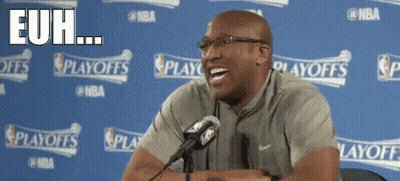 A Man Sitting In Front Of A Microphone With The Words " Euh " On The Bottom Right GIF