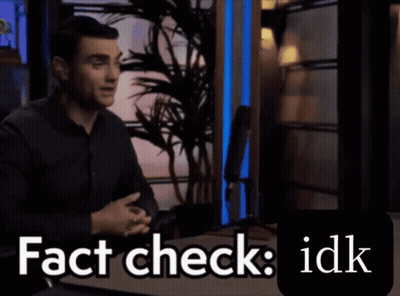 a man sitting in front of a microphone with the words " fact check idk " written below him