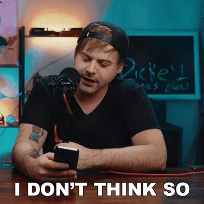 A Man Sitting In Front Of A Microphone With The Words " I Don 'T Think So " Written On The Bottom GIF