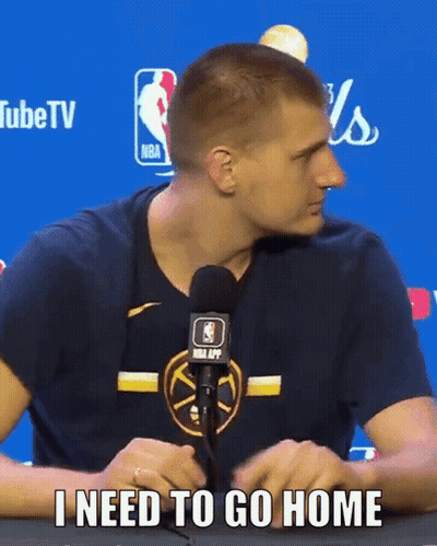 A Man Sitting In Front Of A Microphone With The Words I Need To Go Home GIF