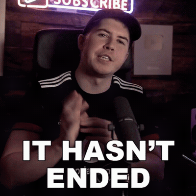 A Man Sitting In Front Of A Microphone With The Words " It Hasn 'T Ended " Below Him GIF